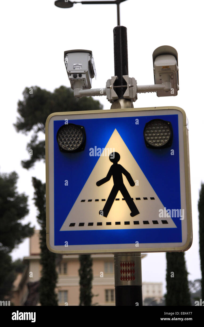 illuminated road sign with warning lights and camera directed traffic control, Monaco, Monte Carlo Stock Photo