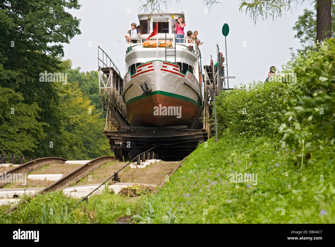 tourist ship at the Elblag Canal being transported over the inclined plane on a rail carriage run only by water power, Poland, Ermland-Masuren Stock Photo