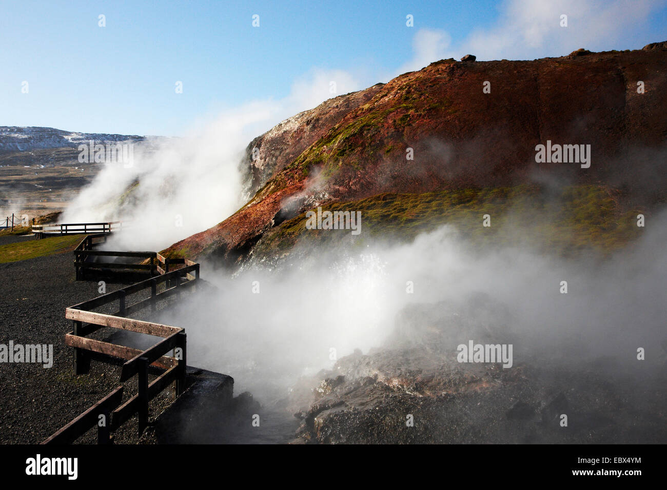 steaming crevices behind a fence in a geothermically active region at Deildartunguhver, Iceland, Suedwest Island Stock Photo