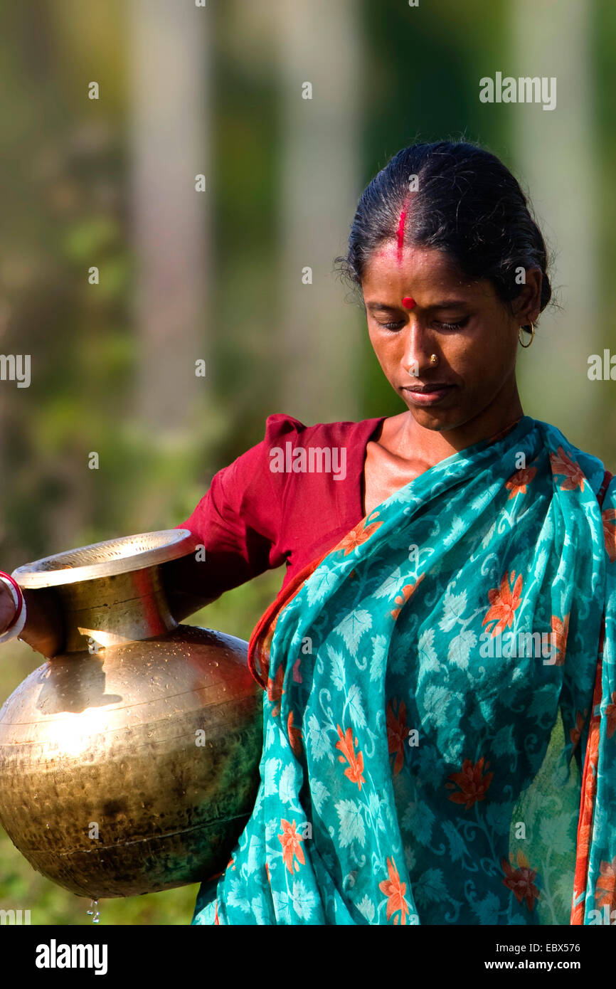 Indian woman carrying water jar, India, Andaman Islands Stock Photo