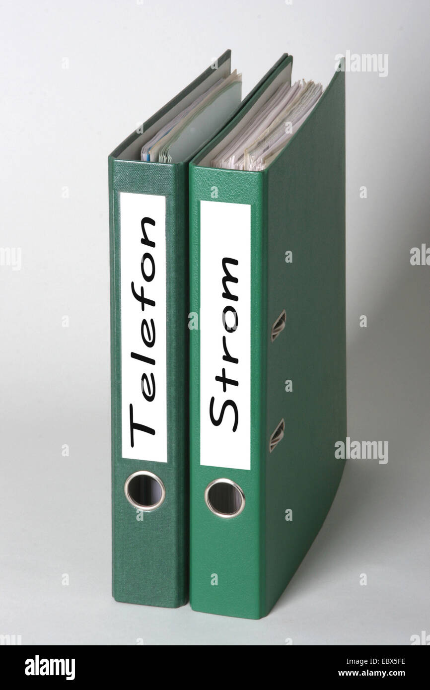 two green files with titles telefon and strom (energie) Stock Photo