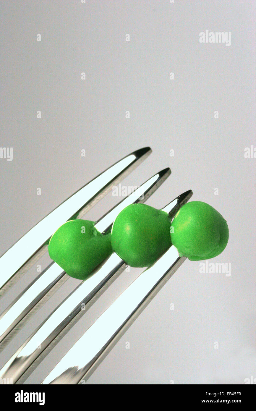 a fork with green peas Stock Photo