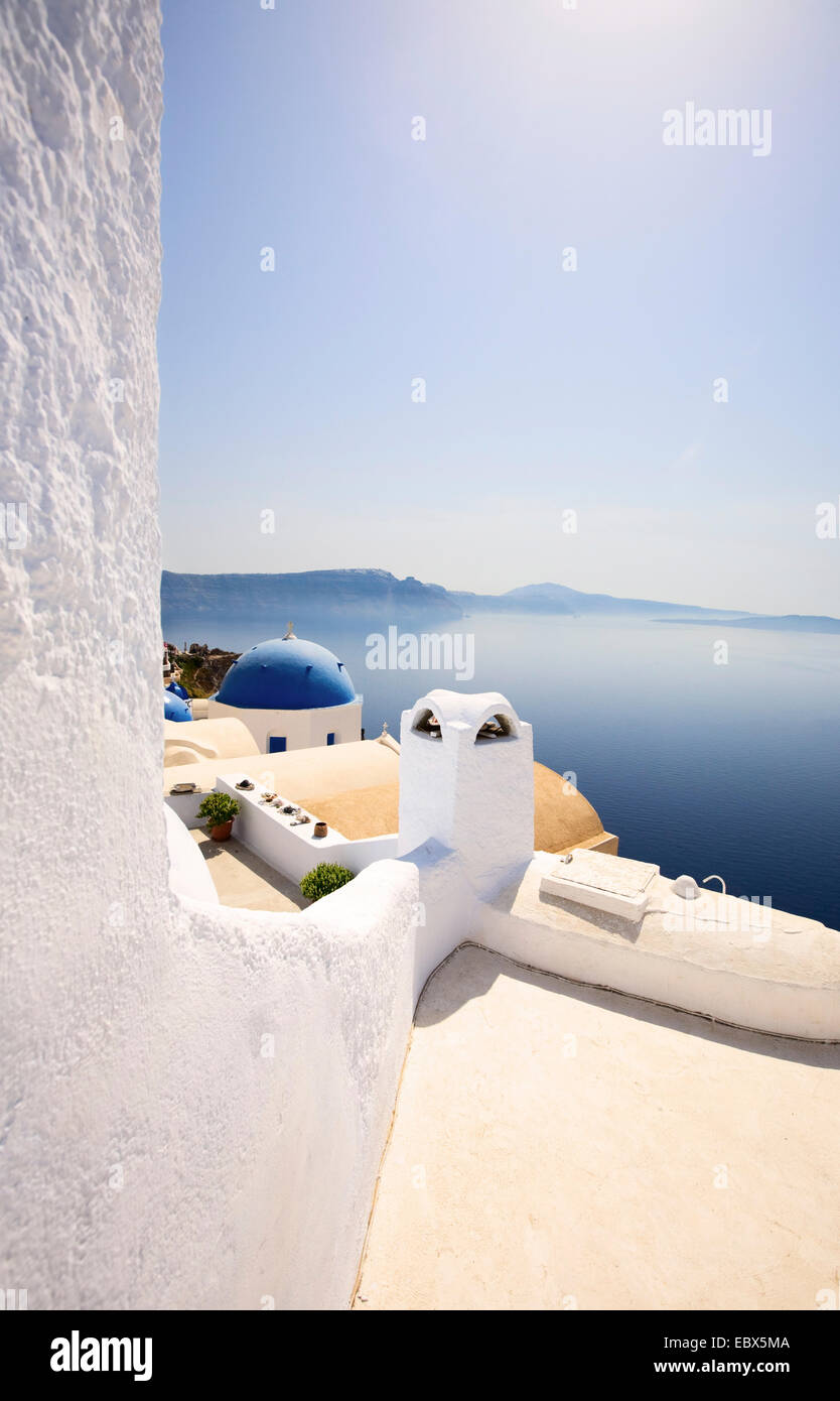 view from the cliff at the sea over the blue dome of a church, Greece, Cyclades, Santorin, Oia Stock Photo