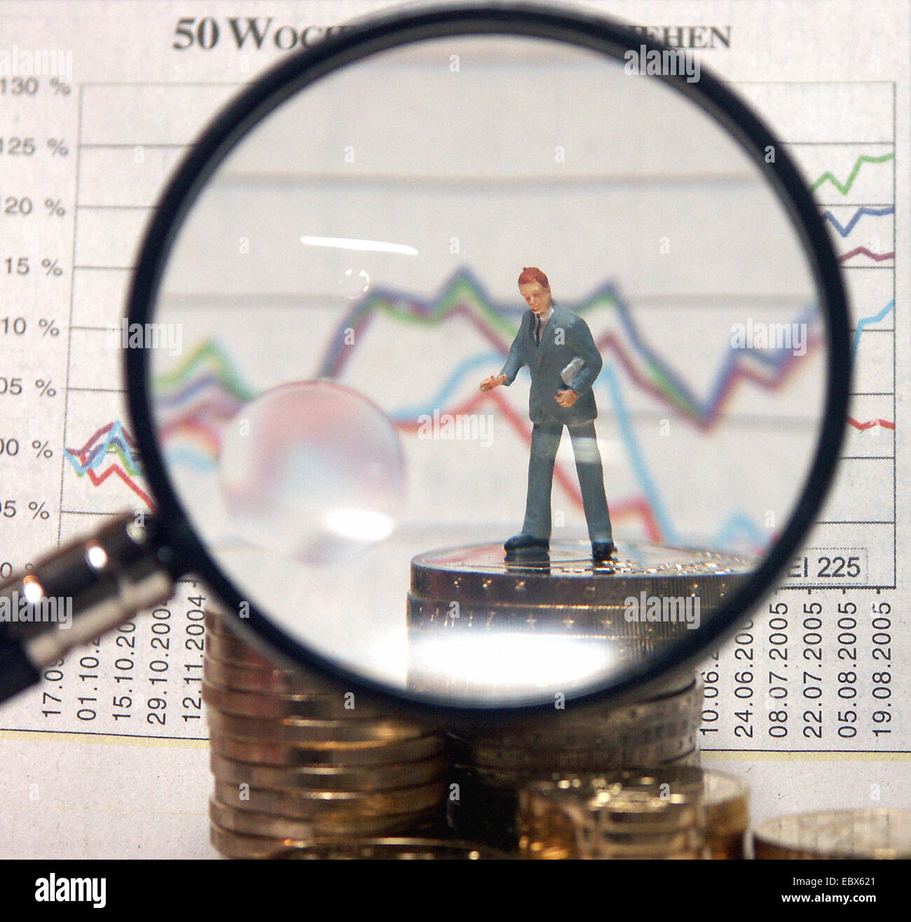 Symbolphoto share price, little figure at coins Stock Photo