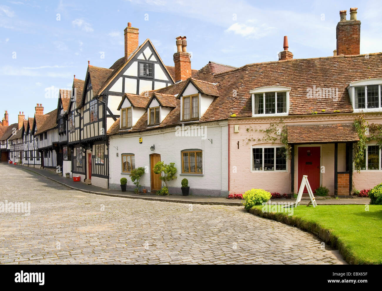 alley with half-timbered houses and cobbled street, United Kingdom, England, Warwickshire, Warwick Stock Photo