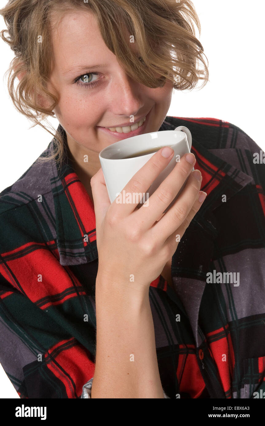 young manufacturer taking a coffee break with a content smile Stock Photo