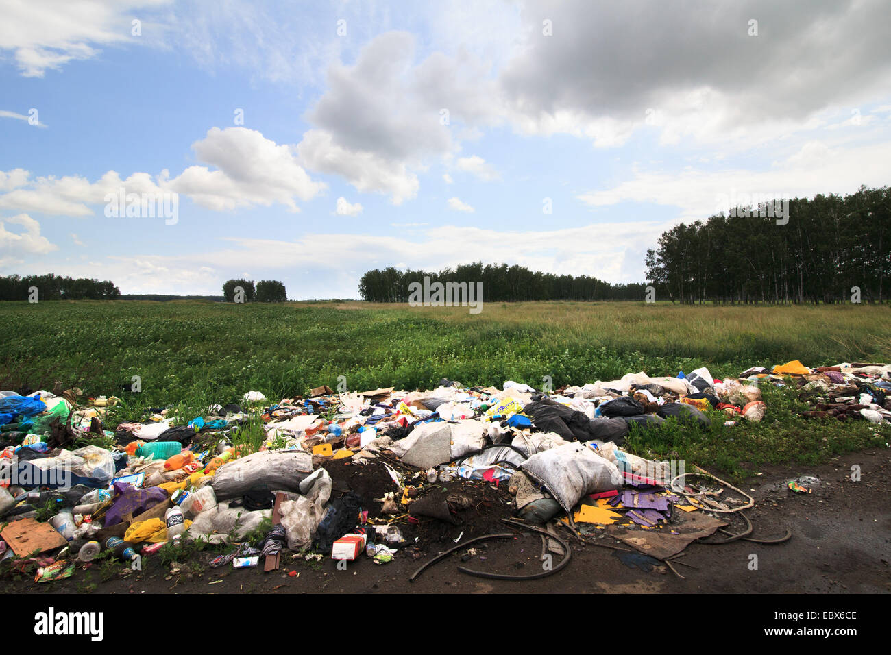 Garbage dump on the side of the fields Stock Photo Alamy