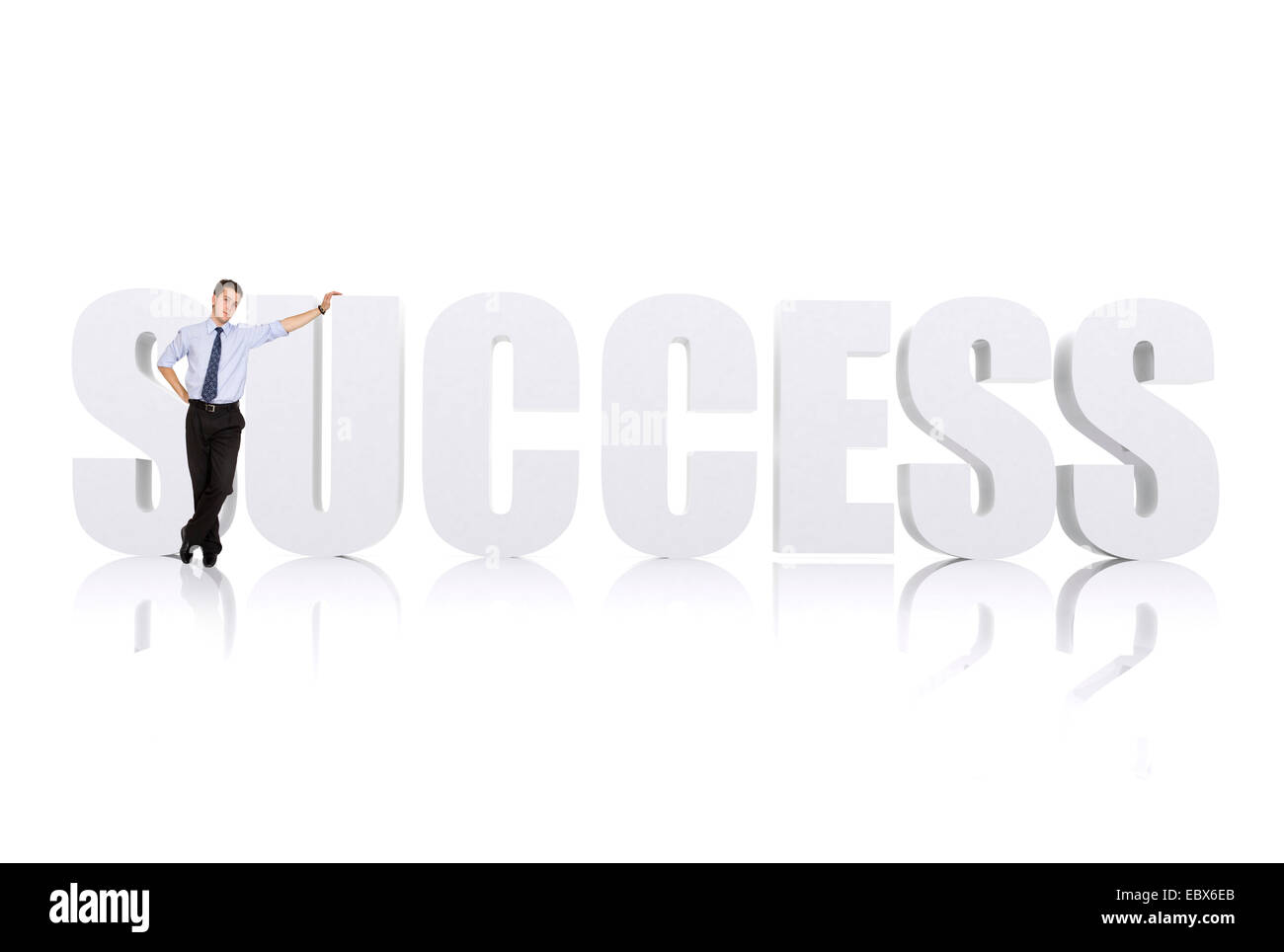 business man leaning on the word success over white Stock Photo