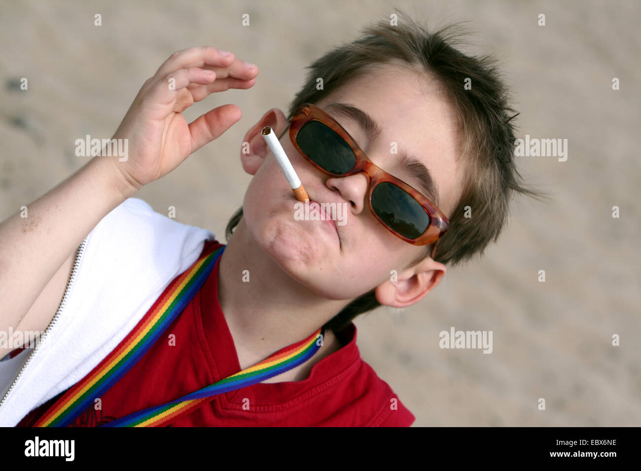 10 years old cool boy with sunglasses and cigarette Stock Photo
