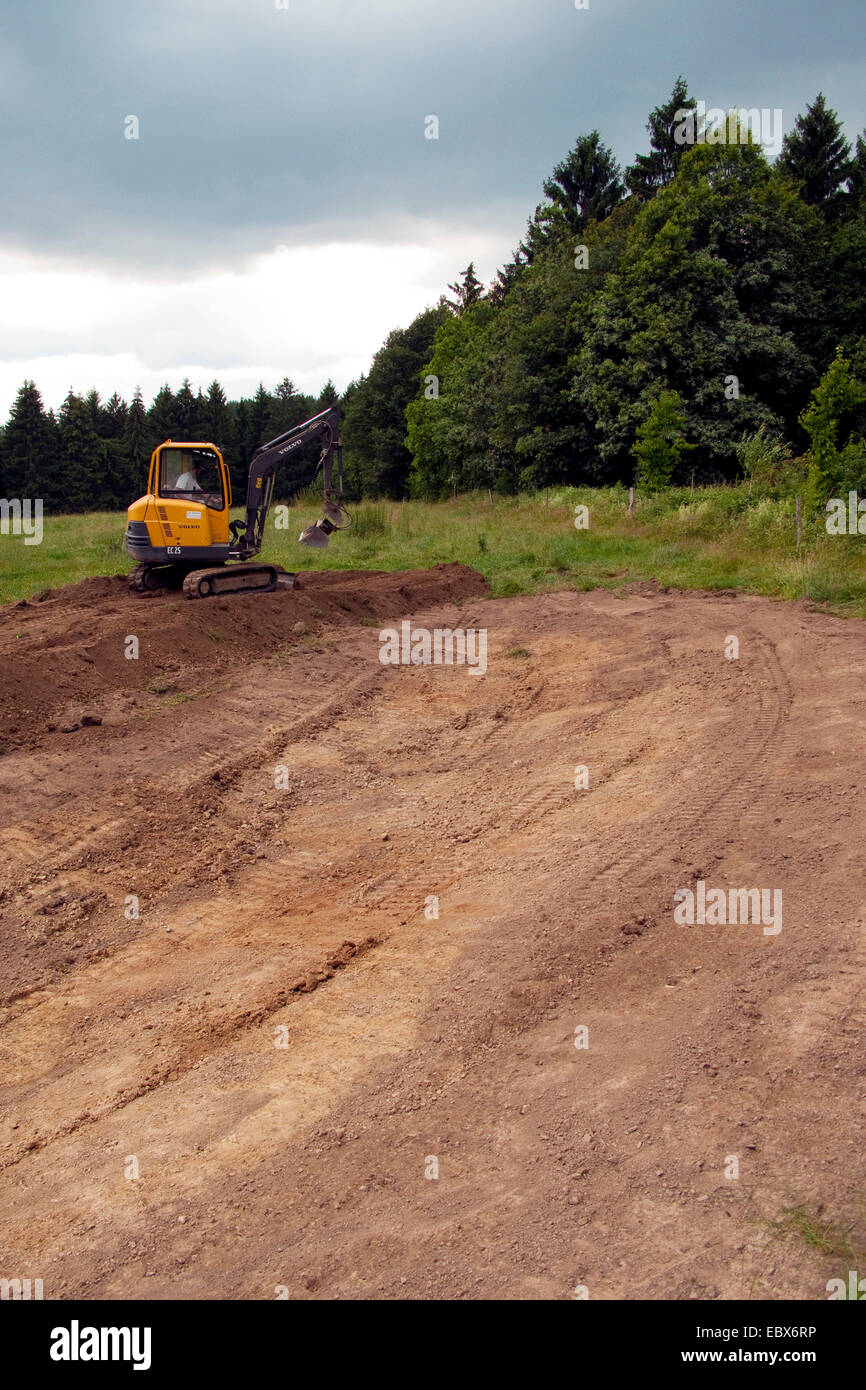 building of a pond with a excavator, Germany, Rhineland-Palatinate Stock Photo
