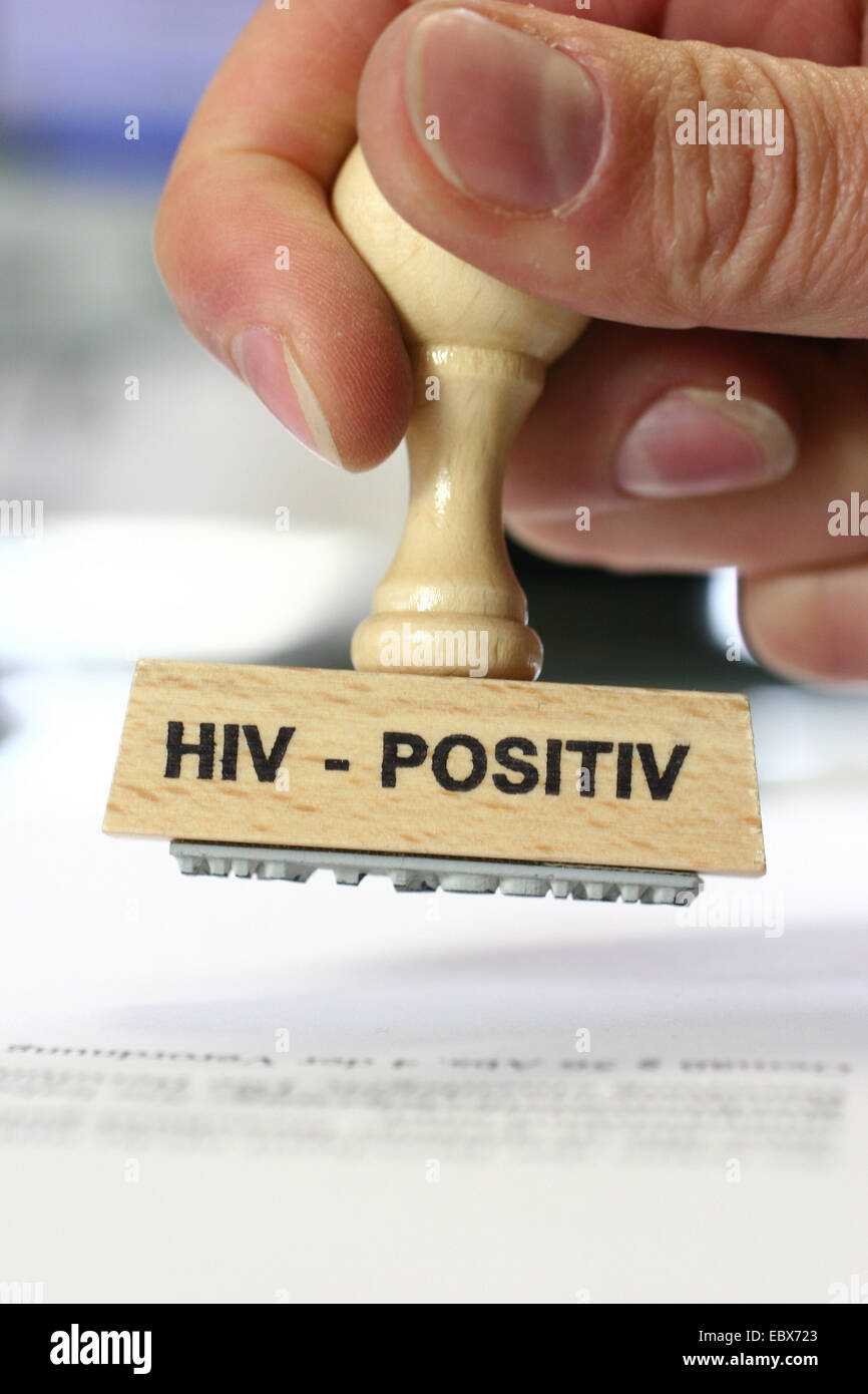 hand with a stamp HIV-positiv, HIV-positiv Stock Photo