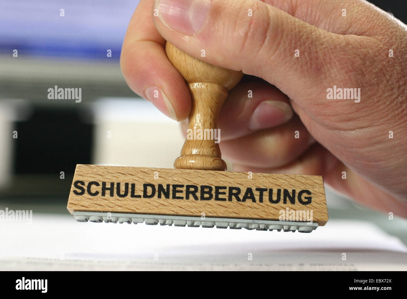 hand with a stamp Schuldnerberatung, credit counseling Stock Photo