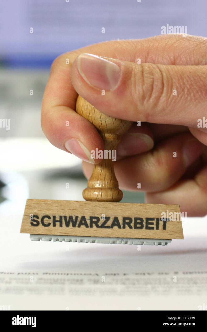 hand with a stamp Schwarzarbeit, moonlighting Stock Photo