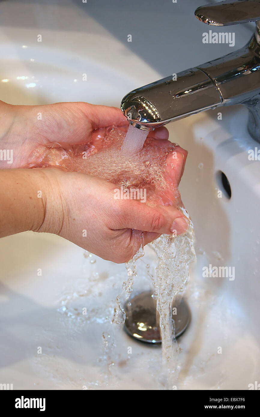 hands under running water Stock Photo