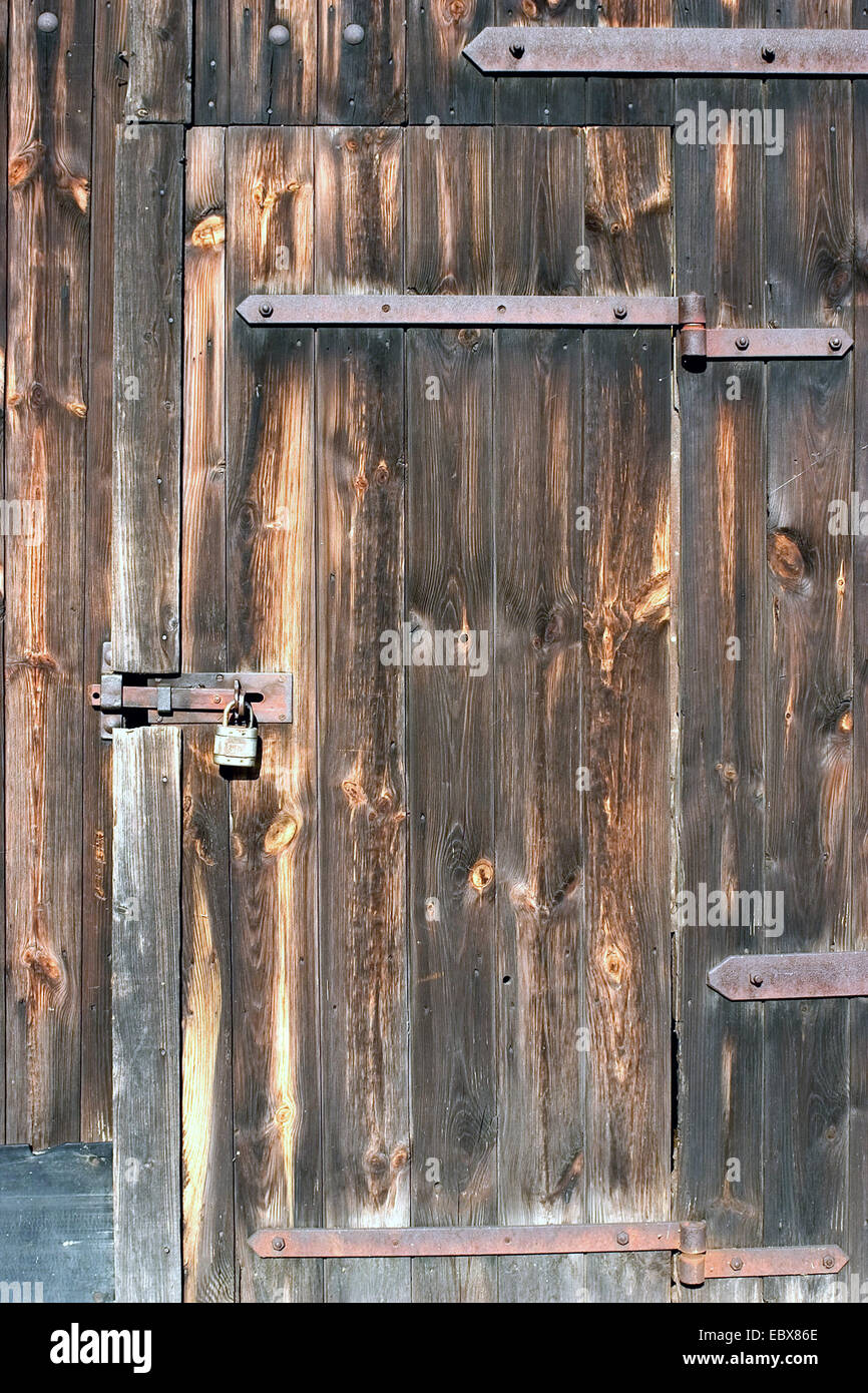 padlock at a wooden door Stock Photo