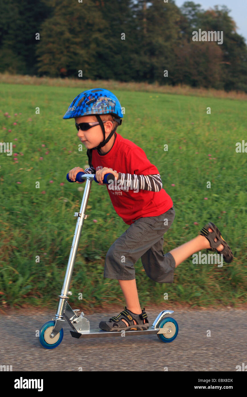 little boy on a kickboard, Switzerland Stock Photo - Alamy