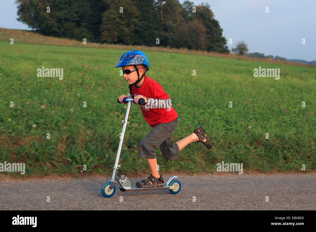 little boy on a kickboard, Switzerland Stock Photo - Alamy