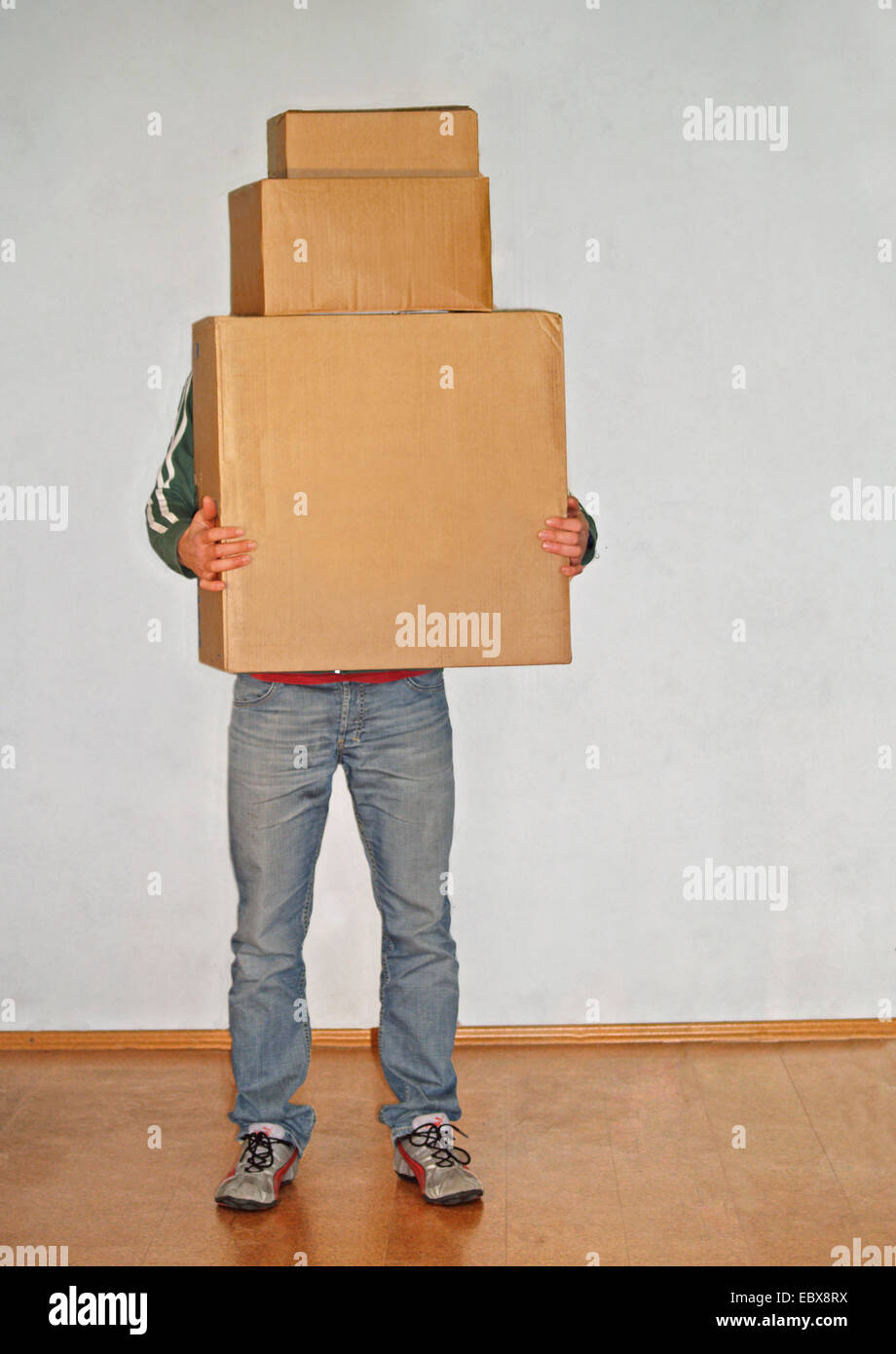 man carrying packing cases Stock Photo