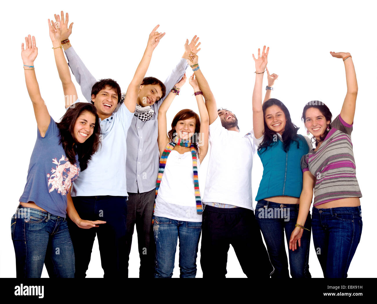 happy group of friends with arms up Stock Photo