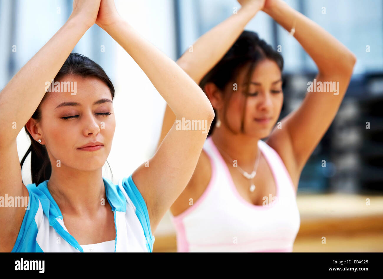 girls doing yoga classes in a gym Stock Photo