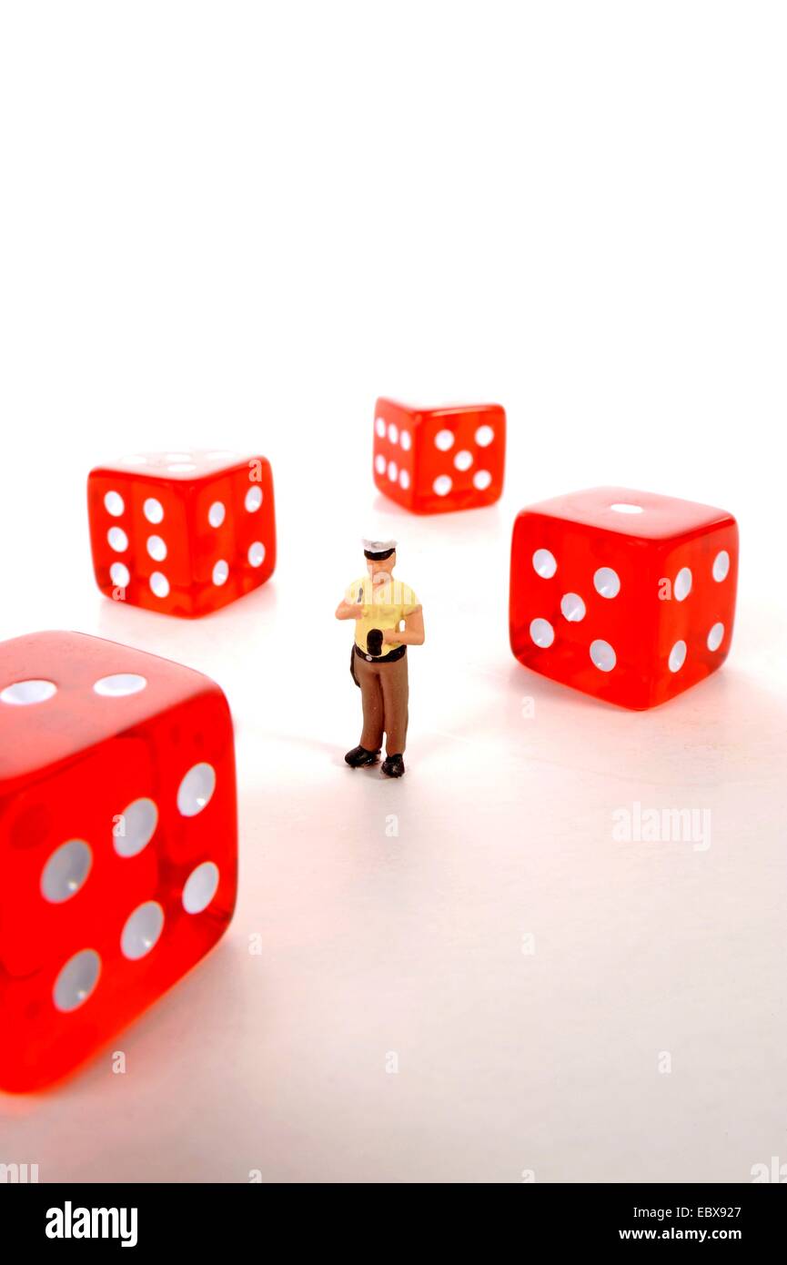 Policeman standing amongst dices hires stock photography and images