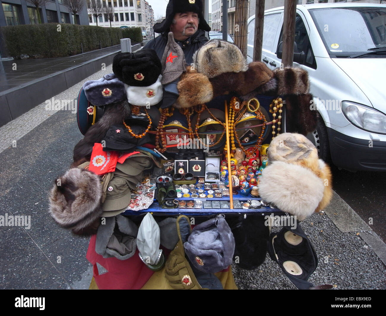 russian street hawker with fur caps, Germany, Berlin Stock Photo