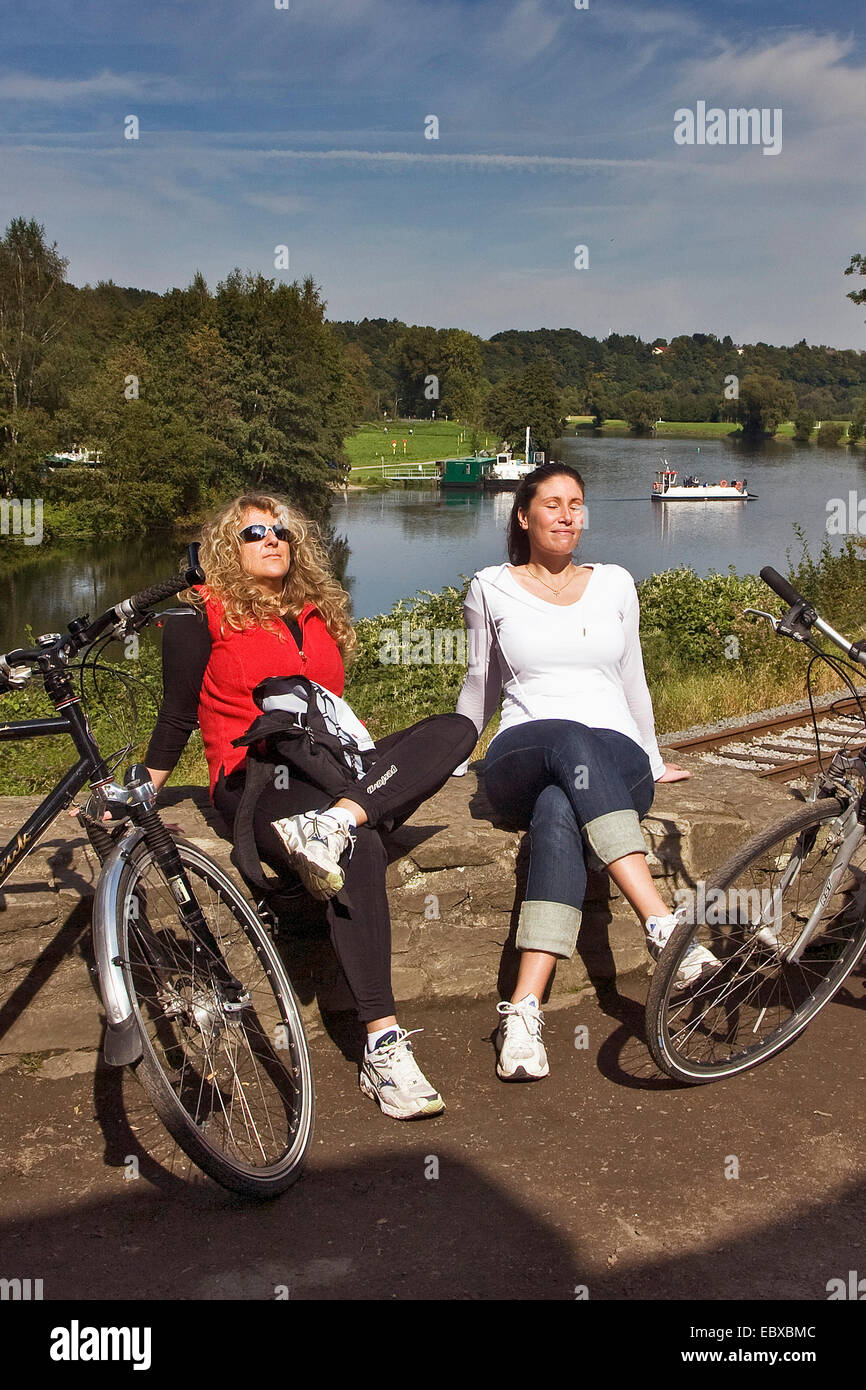 two bicyclists having a break at Hardenstein Castle ruin, Germany, North Rhine-Westphalia, Ruhr Area, Witten Stock Photo