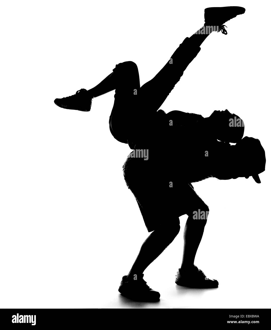 silhouette of a young pair dancing Rock 'n' Roll Stock Photo