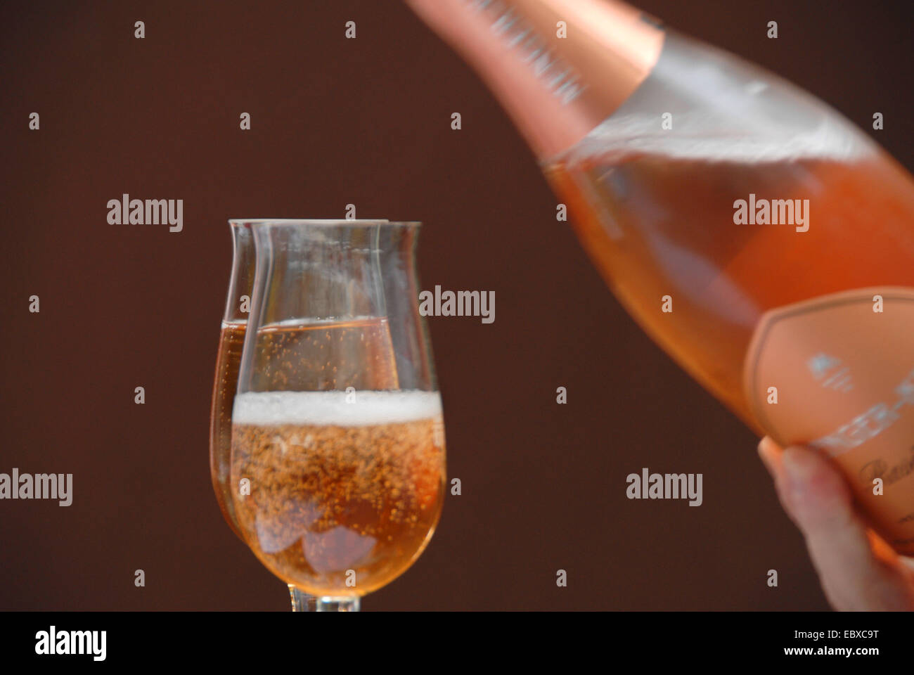 sparkling wine is being poured into glasses, Germany, Rhineland-Palatinate Stock Photo