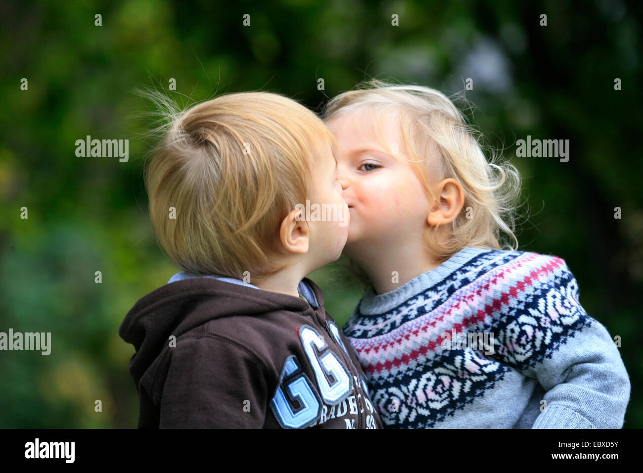 little boy and little girl, kissing Stock Photo
