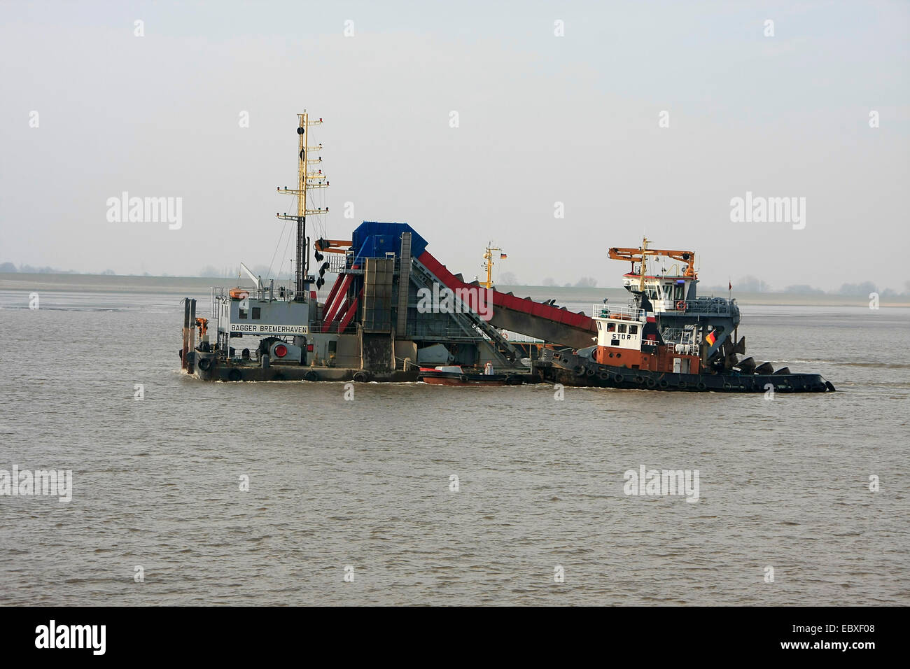 A dredger, also called dredgers, is a specialized vessel which has a technical equipment for dredging of navigation channels, harbors, estuaries, bays or the like. Photo: Klaus Nowottnick Date: March 7, 2014 Stock Photo
