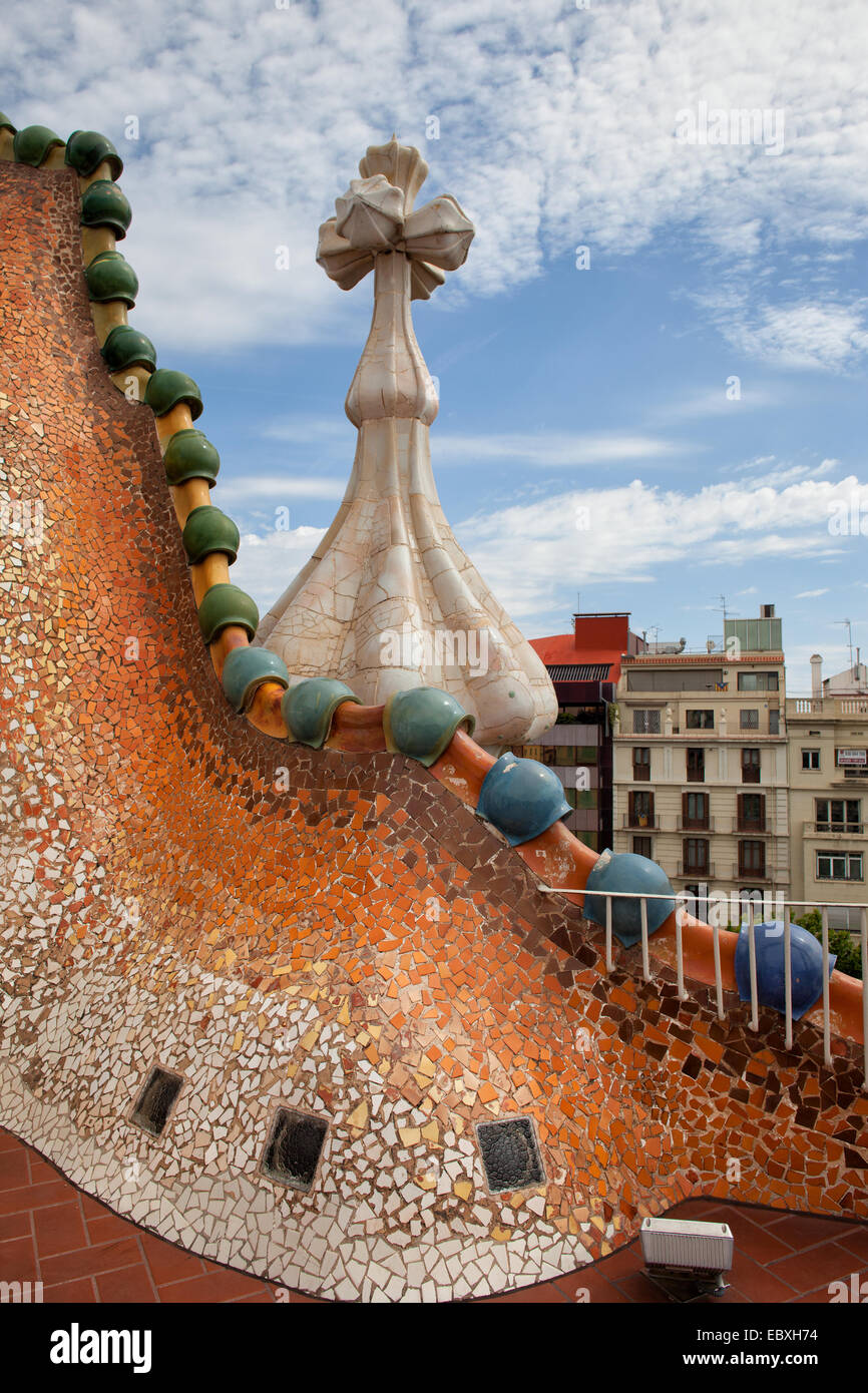 Casa Batllo in Barcelona, Catalonia, Spain. Dragonlike broken tile shards mosaic on attic roof. Stock Photo