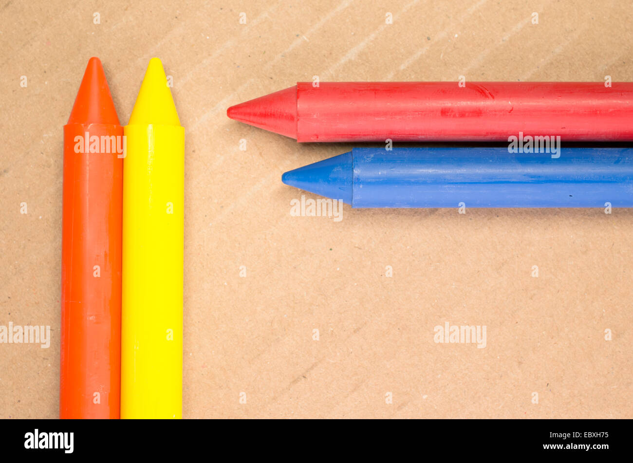 colored wax crayons close up on a light paperboard background Stock ...