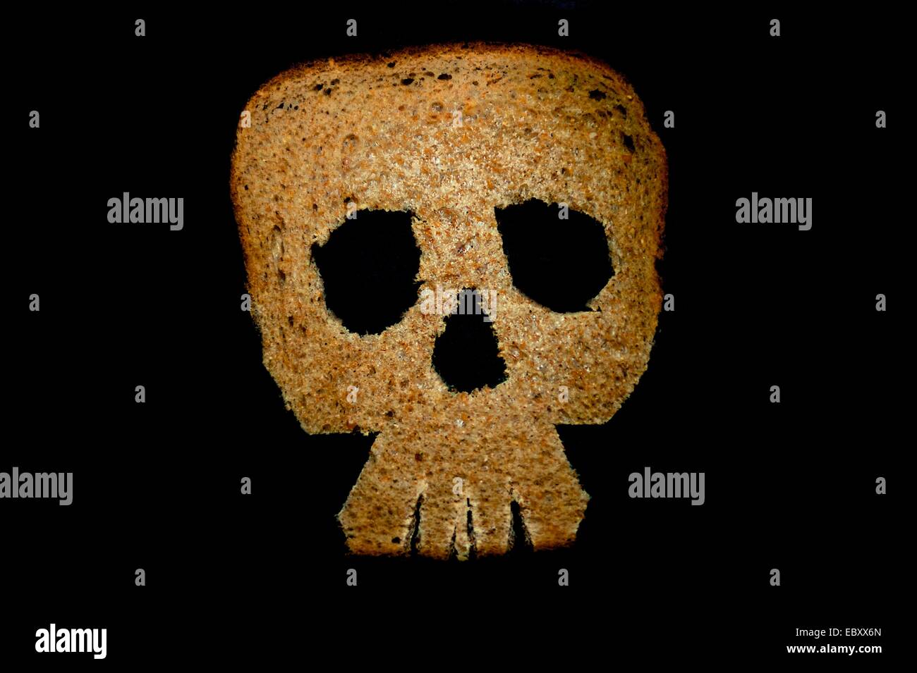Slice of bread in the shape of a human skull Stock Photo