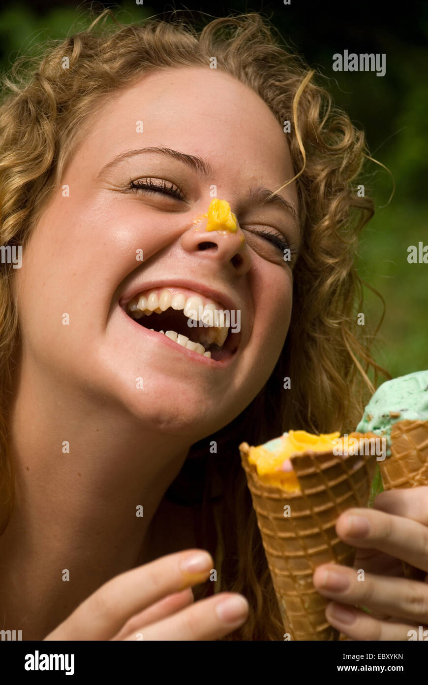 Laughing woman with ice on her nose Stock Photo