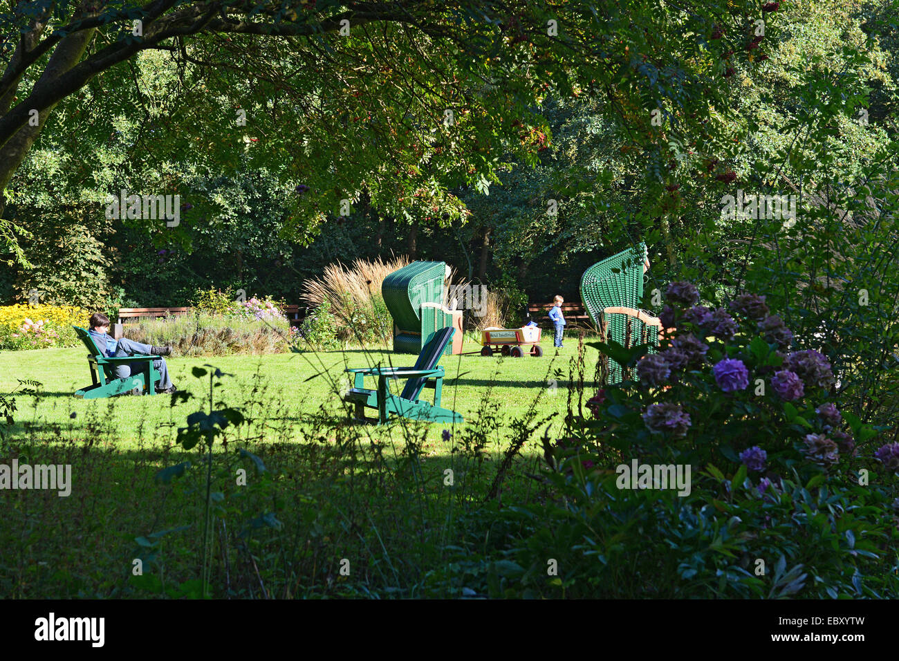 Green beach chairs on green lawn in the green spa park of Spiekeroog; 26 September 2013 Stock Photo