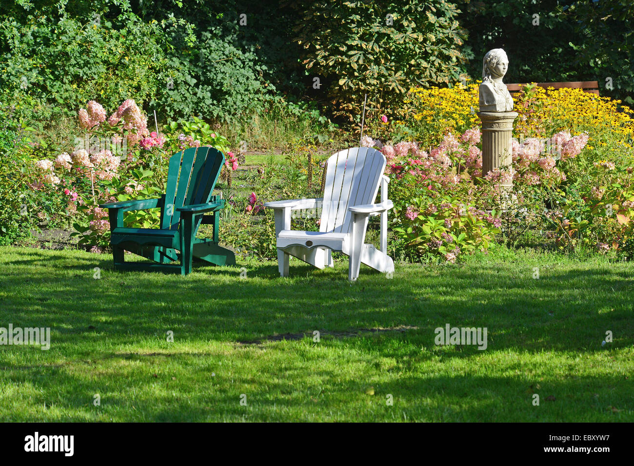 Deck chairs on tutored lawns in the florid spa park of Spiekeroog, 27 September 2013 Stock Photo