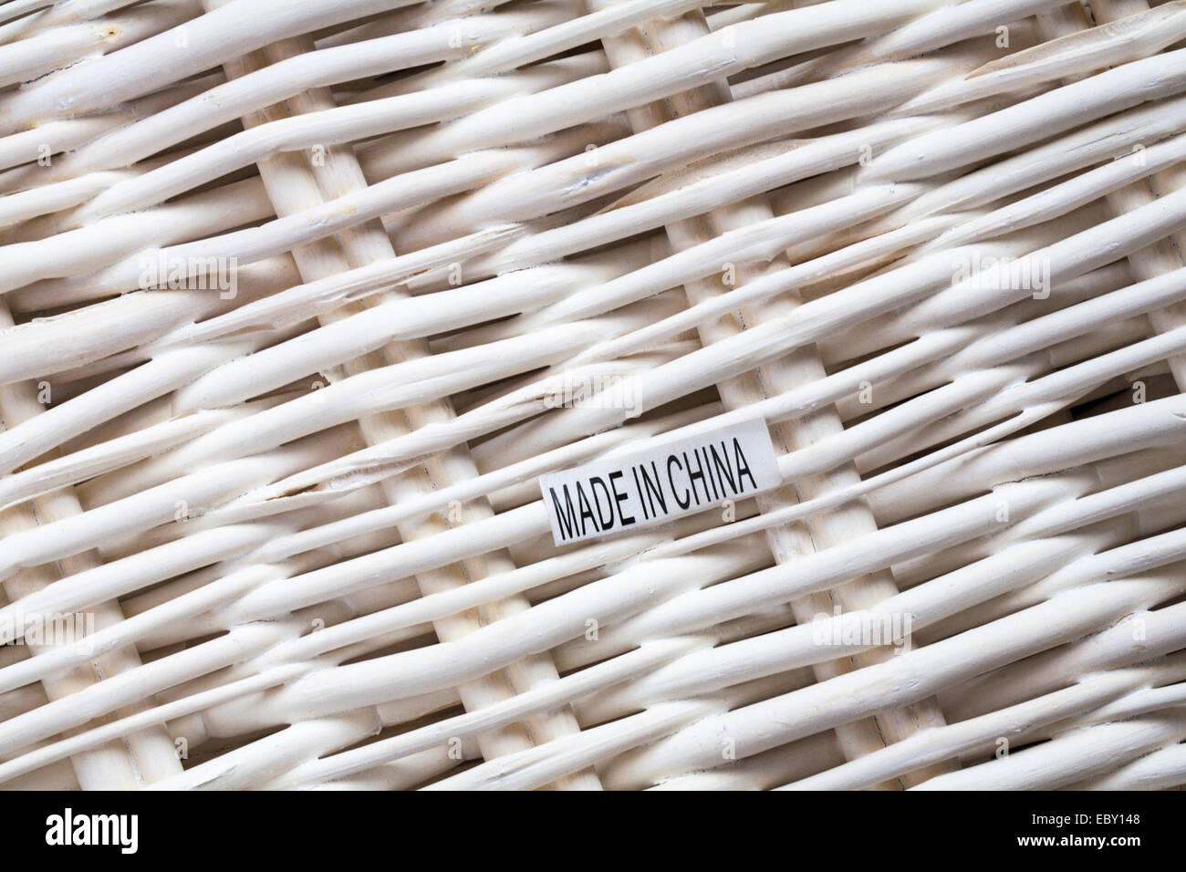 Made in china label on white wicker basket hires stock photography and