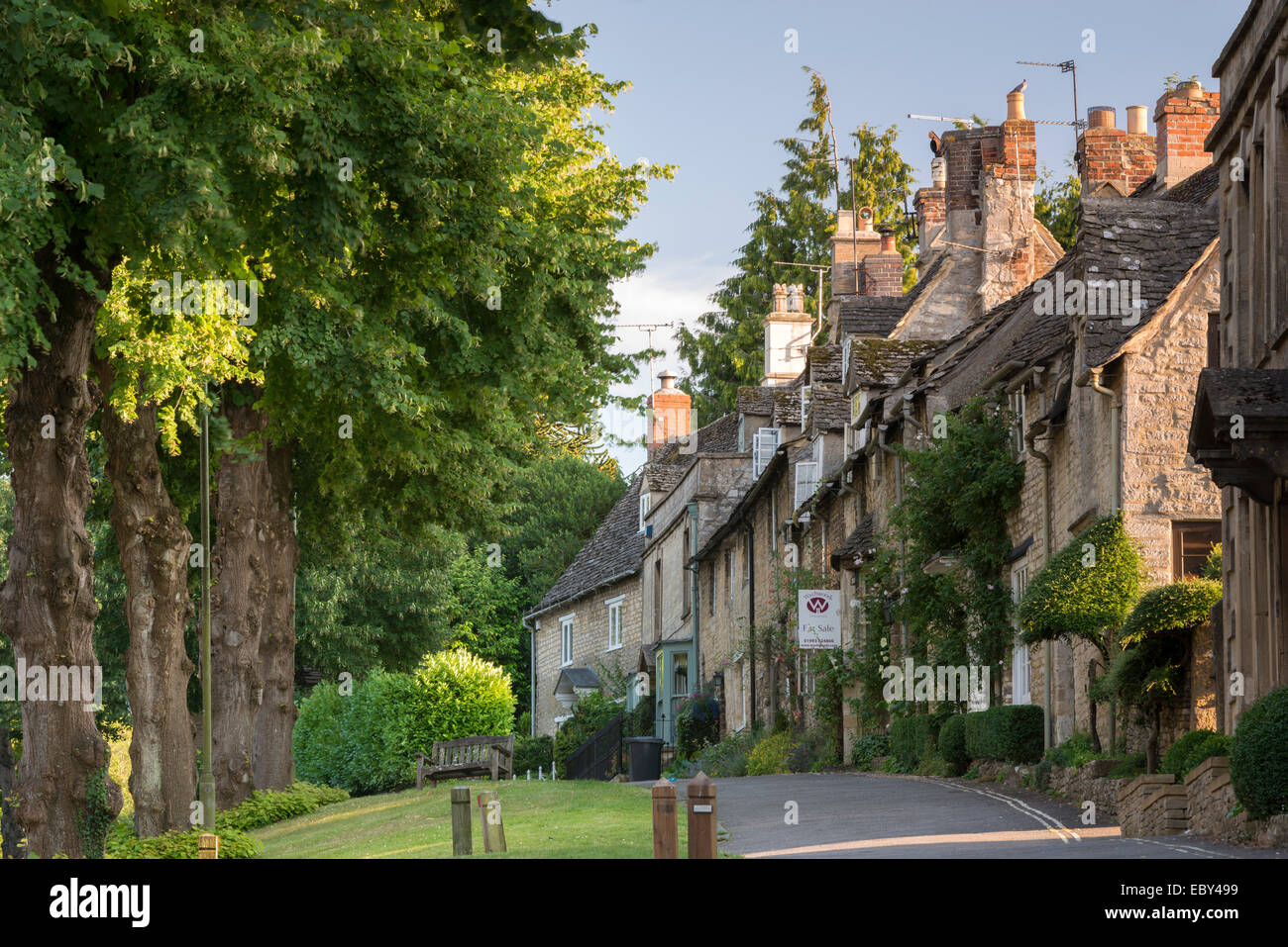 Pretty cottages along The Hill in the Cotswolds town of Burford, Oxfordshire, England. Summer