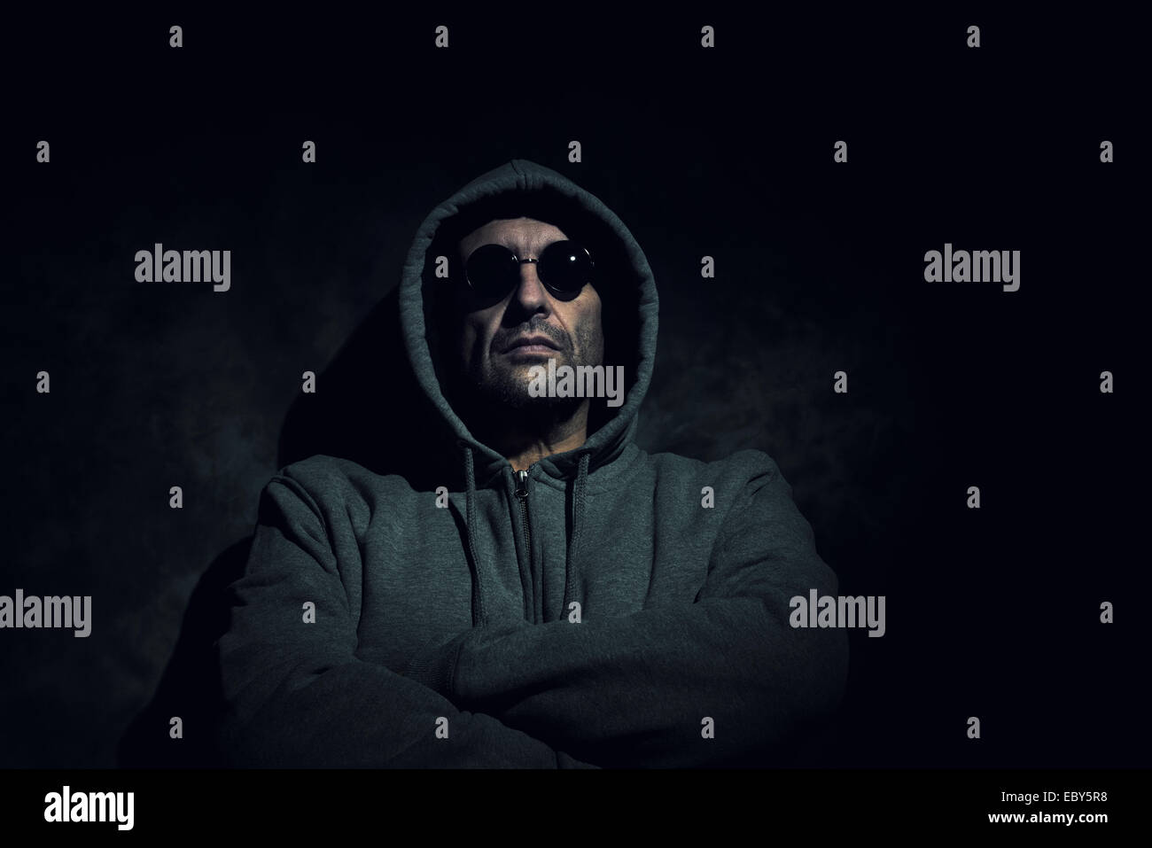 Mysterious, sinister man with black sunglasses Stock Photo