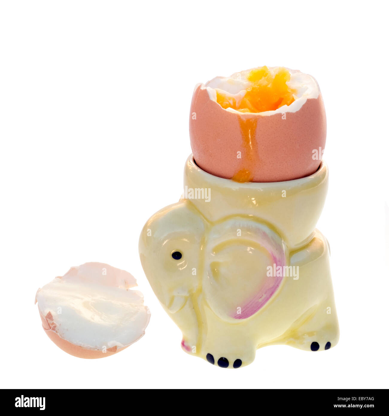 Soft boiled egg in an eggcup cut out or isolated against a white background. Stock Photo