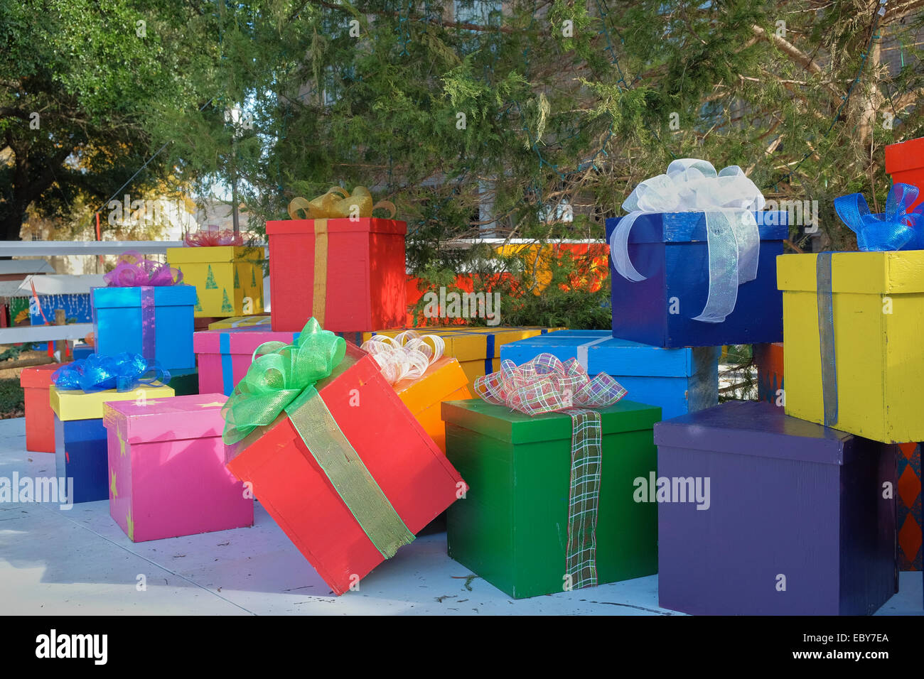 City Christmas display of brightly painted presents under a large Christmas tree, Montgomery Alabama, USA. Stock Photo