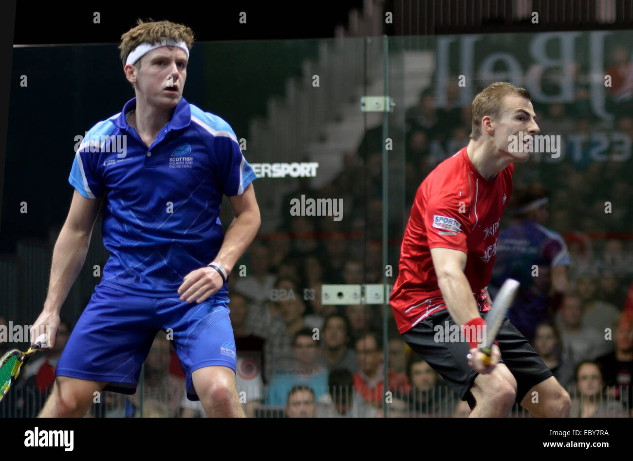 Manchester, UK. 5th December, 2014. Nick Matthew (England), in red  three times world champion wins his first round match of the A J Bell British Squash Grand Prix against Greg Lobban (Scotland).  British Squash Grand Prix Sportcity,  Manchester, UK Credit:  John Fryer/Alamy Live News Stock Photo