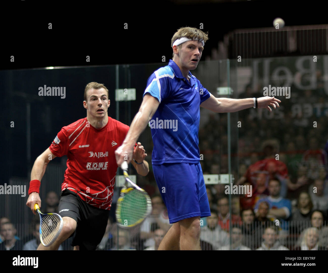 Manchester, UK. 5th December, 2014. Nick Matthew (England), in red  three times world champion wins his first round match of the A J Bell British Squash Grand Prix against Greg Lobban (Scotland).  British Squash Grand Prix Sportcity,  Manchester, UK Credit:  John Fryer/Alamy Live News Stock Photo
