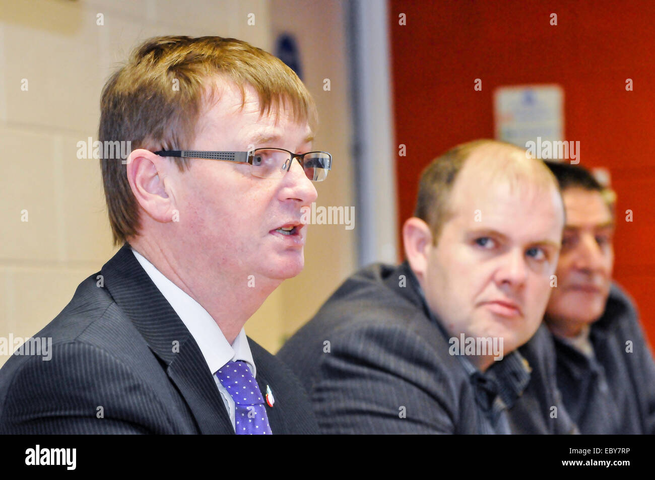 Belfast, Northern Ireland, UK. 5th December, 2014. Rab Magee from the Protestant Coalition looks on as Northern Ireland victims' campaigner Willie Frazer gives a press conference.  Credit:  Stephen Barnes/Alamy Live News Stock Photo