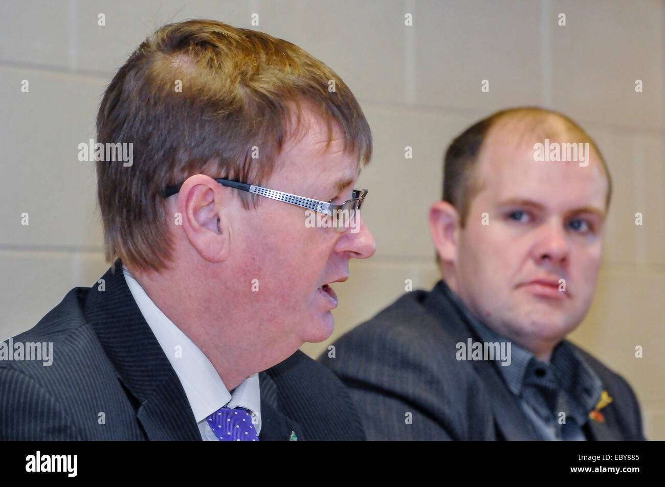 Belfast, Northern Ireland, UK. 5th December, 2014. Rab Magee looks on as Northern Ireland victim's campaigner Willie Frazer holds a press conference. Credit:  Stephen Barnes/Alamy Live News. Stock Photo