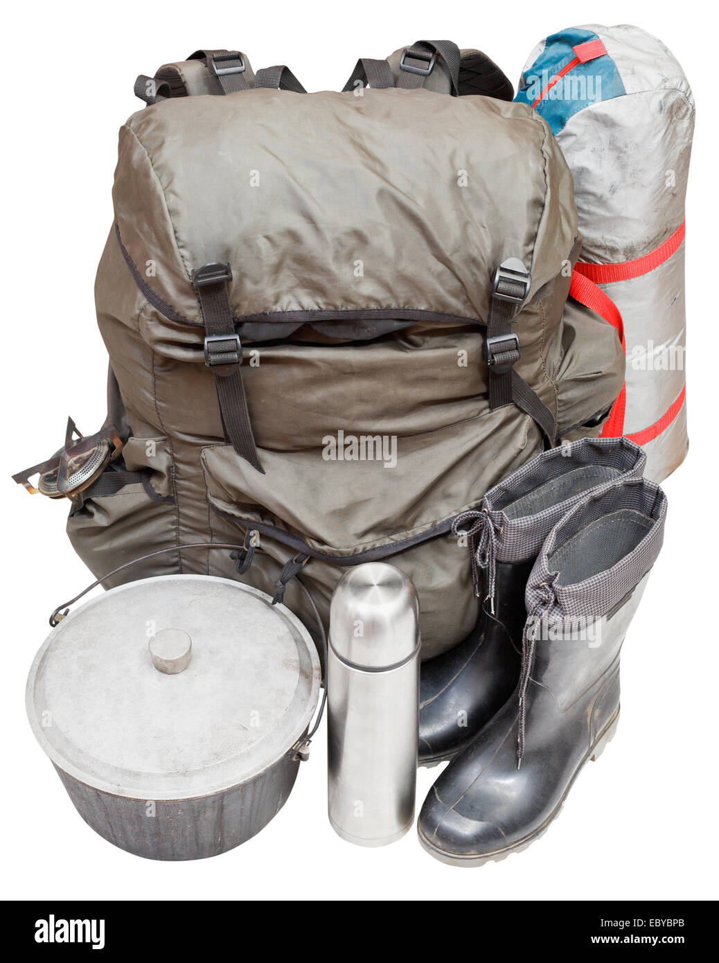 set of expedition equipment with backpack, tent, pot, rubber boots, thermos, gas burner isolated on white background Stock Photo