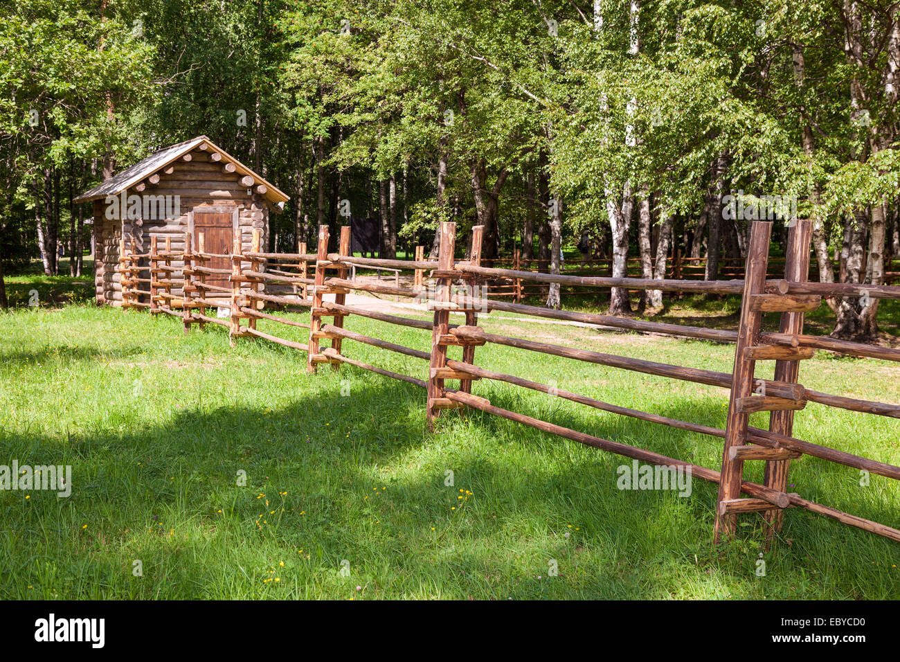 Wooden fence with small wooden house in countryside Stock Photo - Alamy