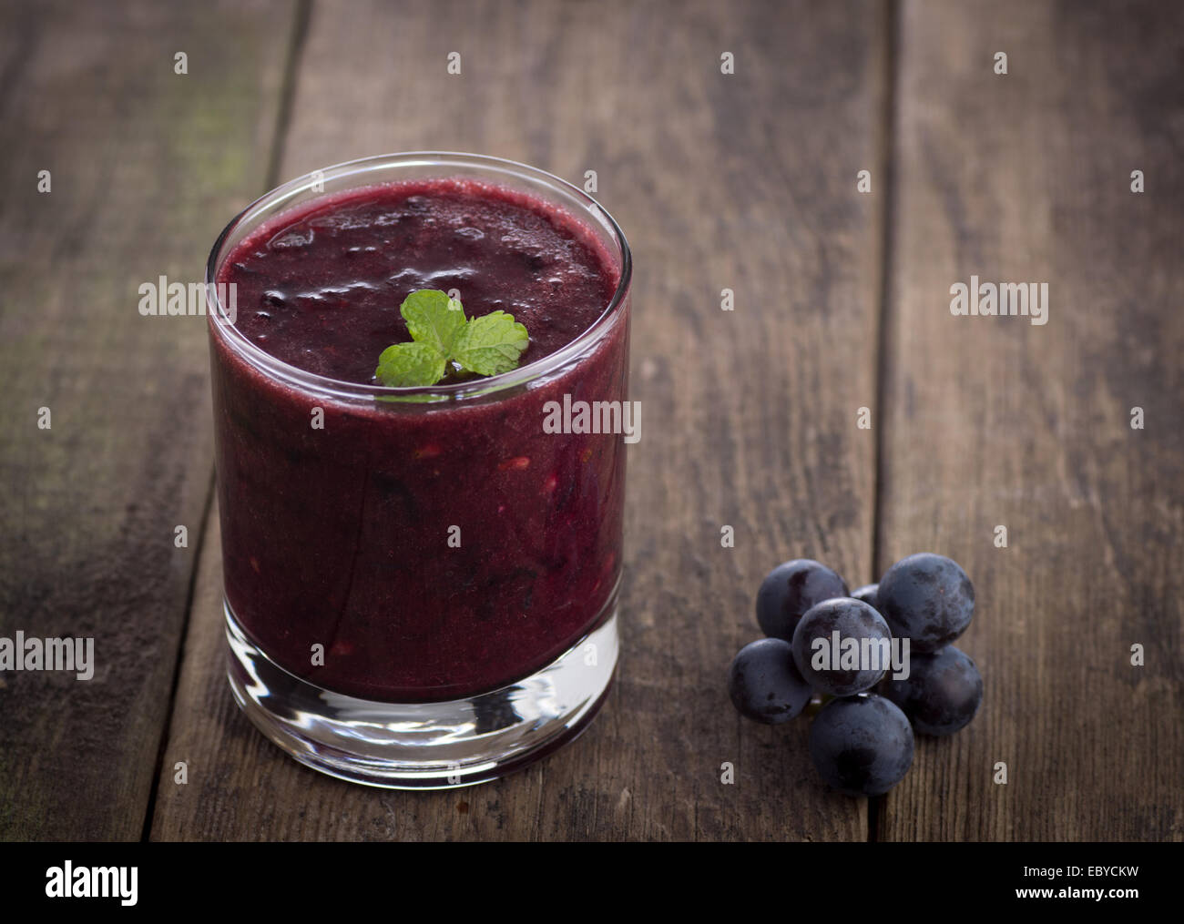 Glass of Grape Juice smoothie on wooden Stock Photo Alamy