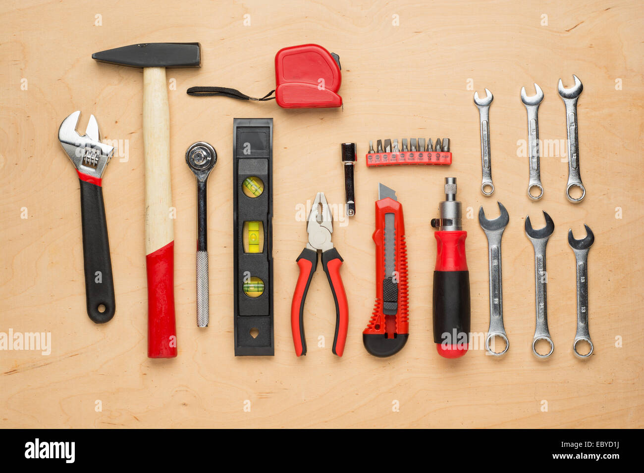 Set of hand tools on a wooden panel Stock Photo